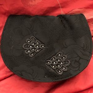 Stuart Weitzman satin clutch. Very feminine look.